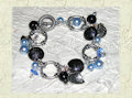 bracciale con perle, cristalli swarovski e accessori in metallo